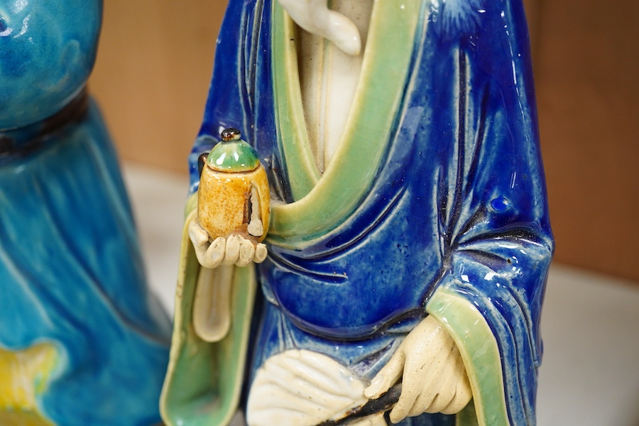 Two Chinese pottery glazed figures to include a Shiwan mudman, largest 48cm high